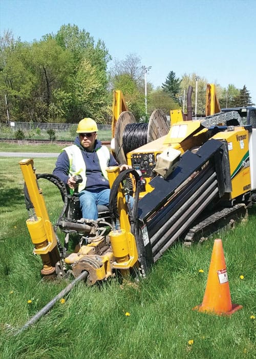 Operator using a Vermeer Navigator horizontal directional drill for underground utility installation supported by Xpert construction platform.